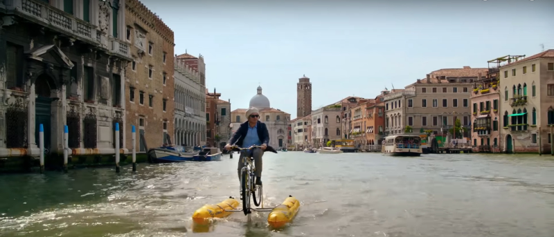 Or “riding whatever this is down a canal” music (Photo: Amazon Studios)